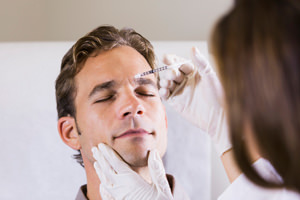 Man receiving BOTOX treatment